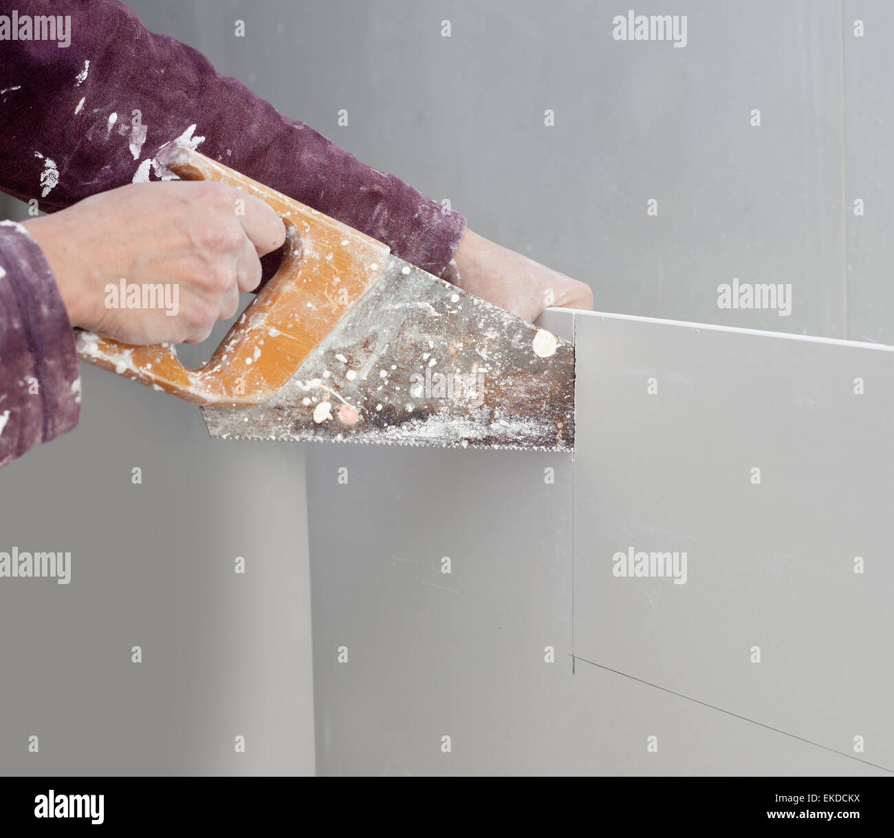 cutting plasterboard plaster hand dirty saw Stock Photo Alamy
