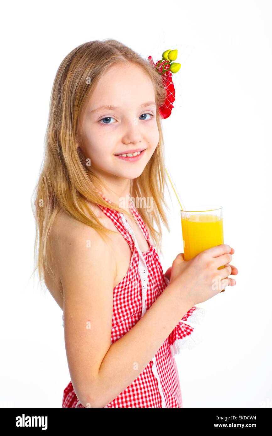 Portrait of little girl drinking orange juice Stock Photo - Alamy