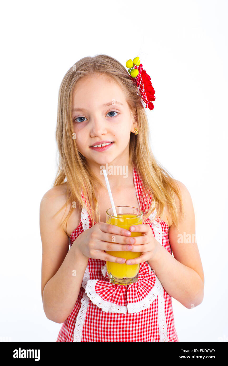 Portrait of little girl drinking orange juice Stock Photo - Alamy