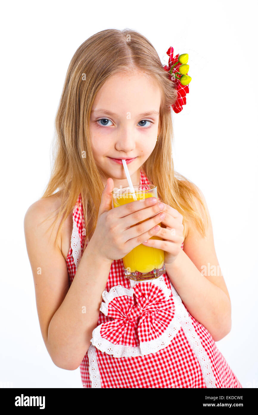 Portrait of little girl drinking orange juice Stock Photo - Alamy