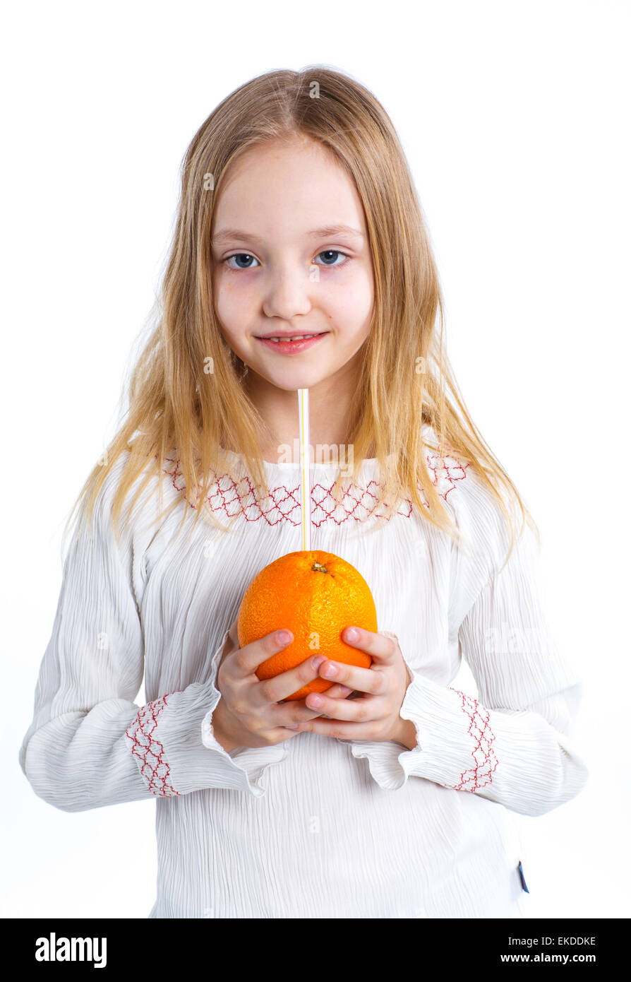 Portrait of little girl drinking orange juice Stock Photo - Alamy
