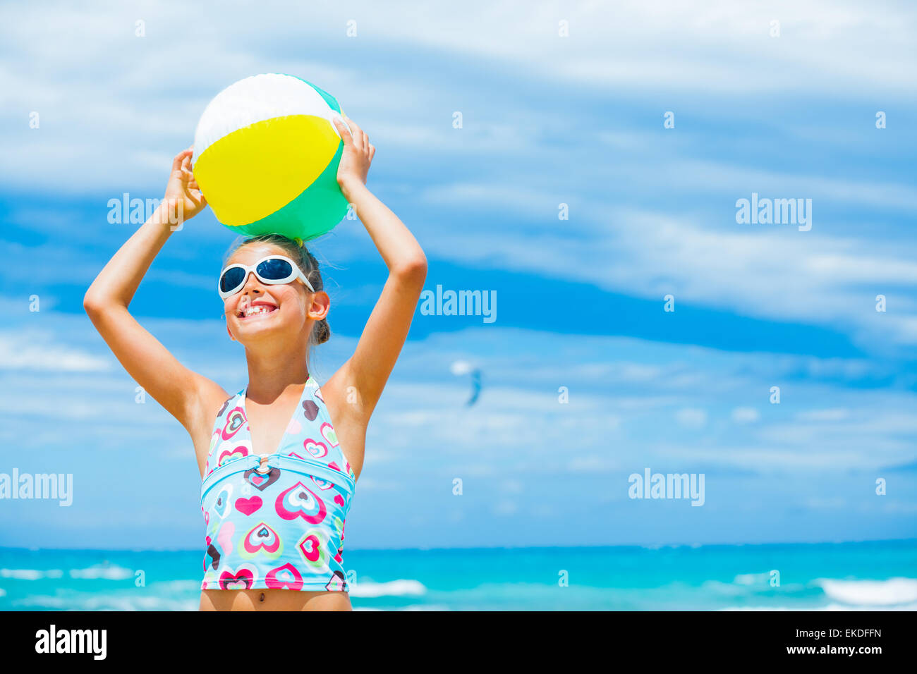 Girl with ball on the beach Stock Photo - Alamy