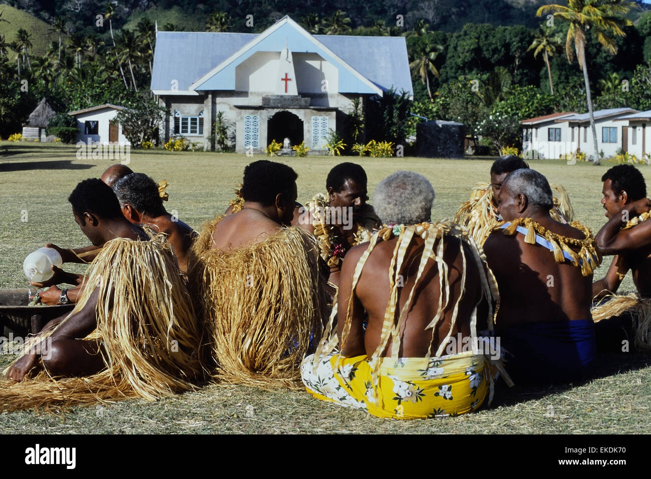 Traditional Fijian warriors preparing Kava. Malakati village. Nacula island. Fiji. South Pacific Stock Photo