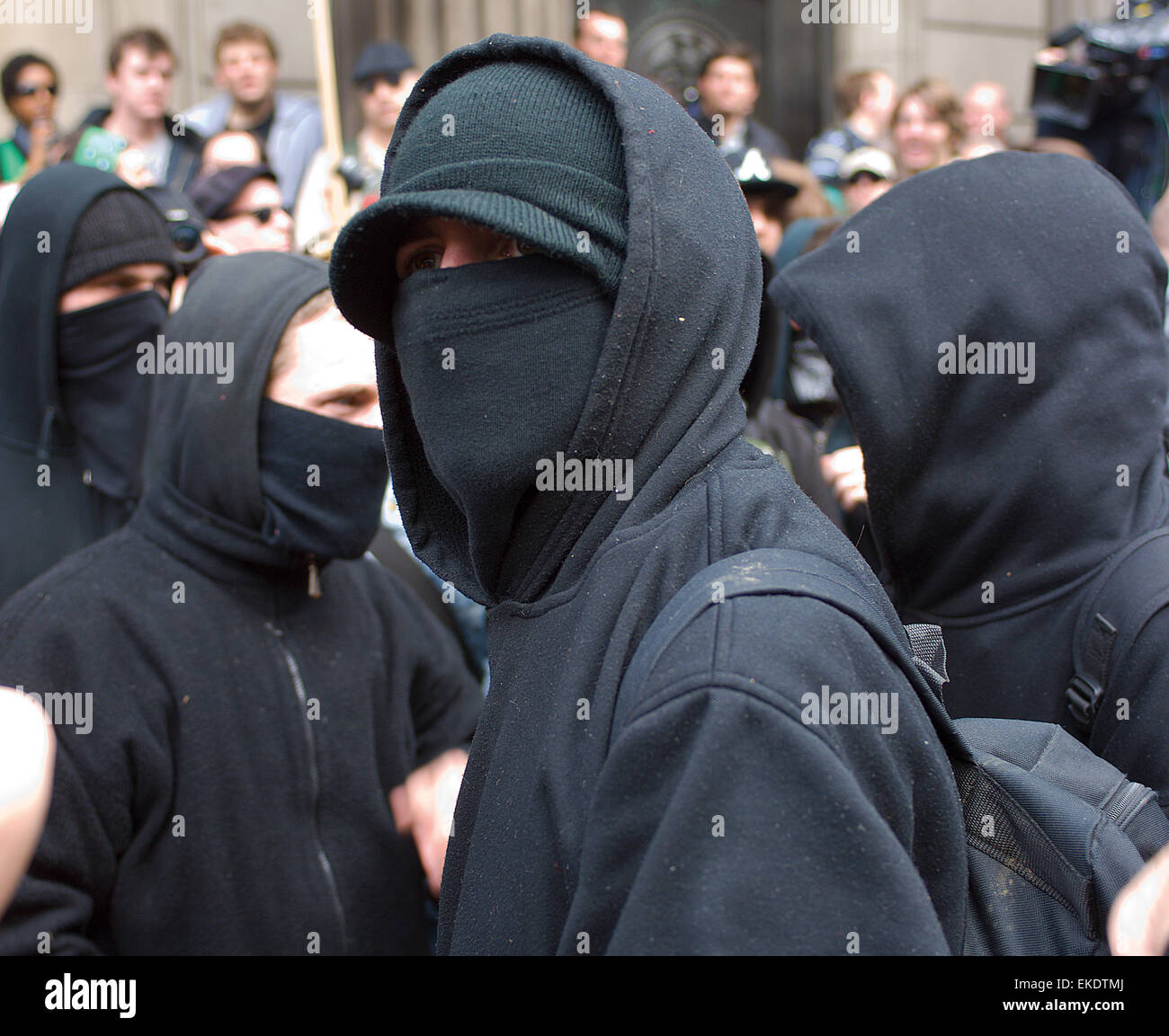 These masked men in hoodies looked ready for trouble at the G20 protest outside the Bank of England. Stock Photo