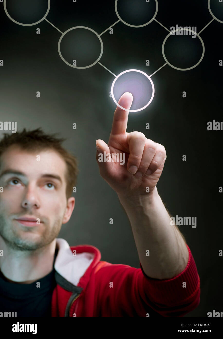 Young Man Pushing The Button Stock Photo Alamy