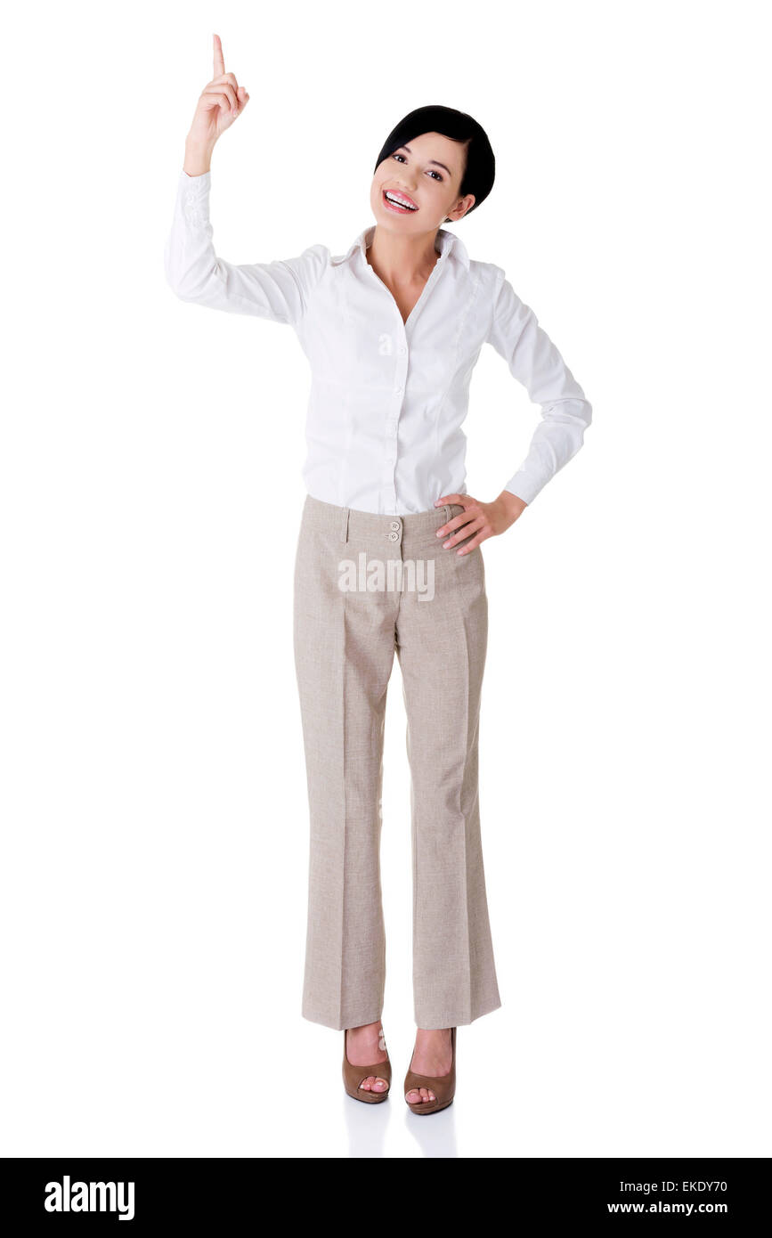 Beautiful business woman showing on copy space Stock Photo - Alamy