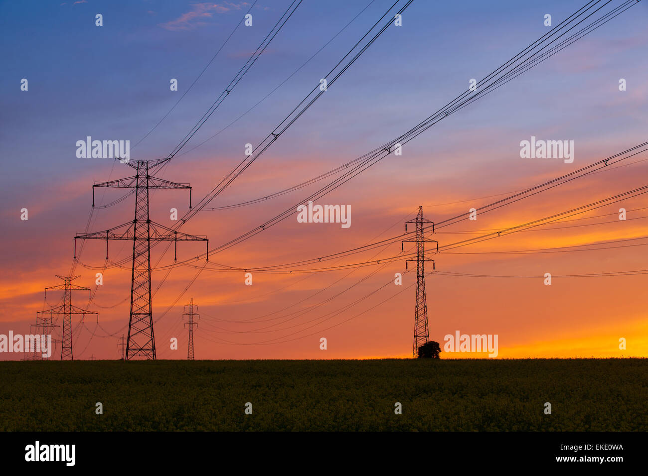 Silhouette of high voltage electrical pole structure at sunset Stock ...