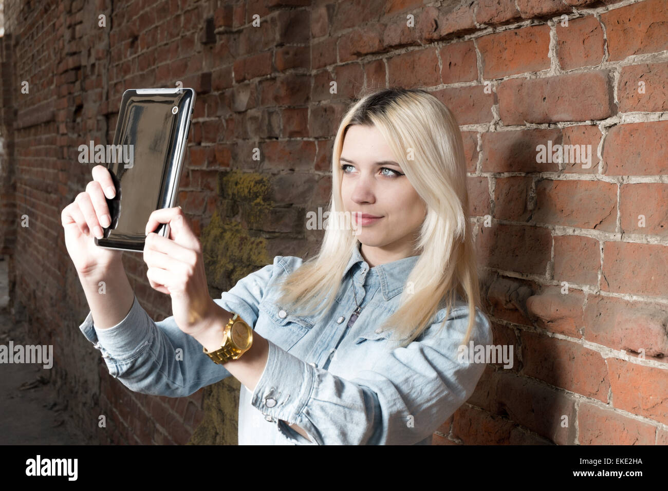 Selfie. Young blond hipster girl make selshot outdoors, copyspace Stock Photo