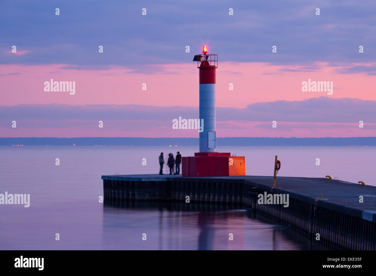 A lighthouse during a colourful sunset on Lake Ontario at Waterworks