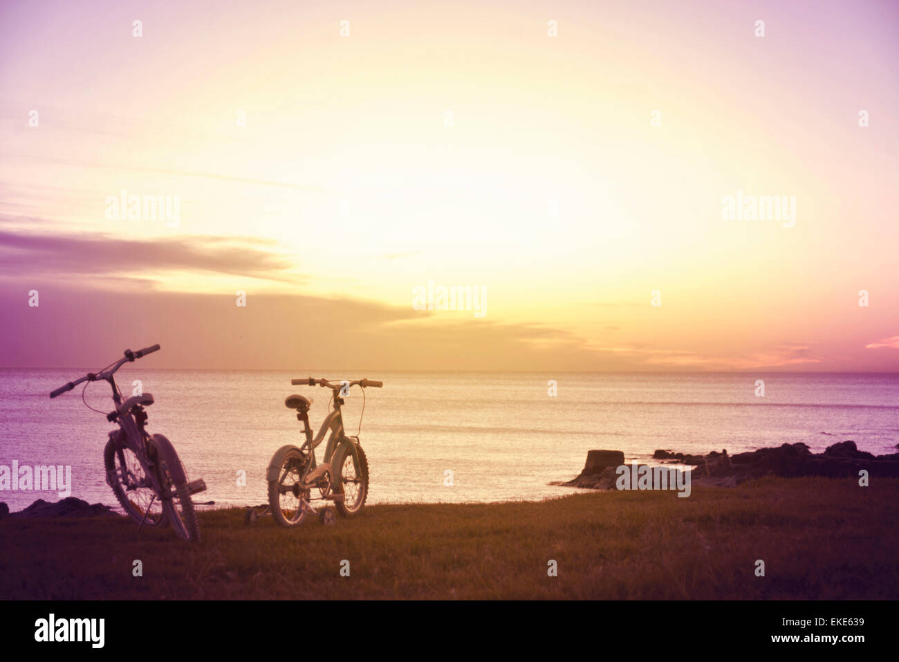 Hipster family fun bikes at sunset. Enjoy summer concept photography. Stock Photo