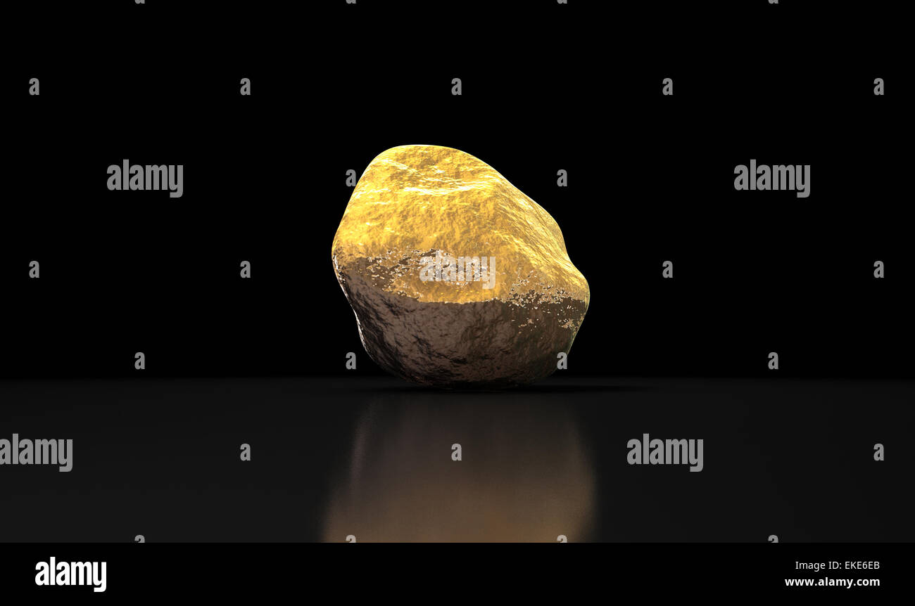 A gold nugget on an isolated dark background Stock Photo