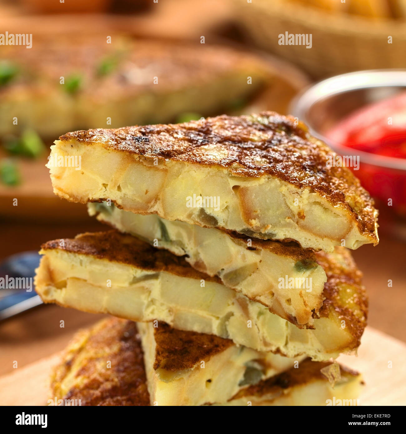 Fresh homemade Spanish tortilla (omelette with potatoes and onions) slices Stock Photo