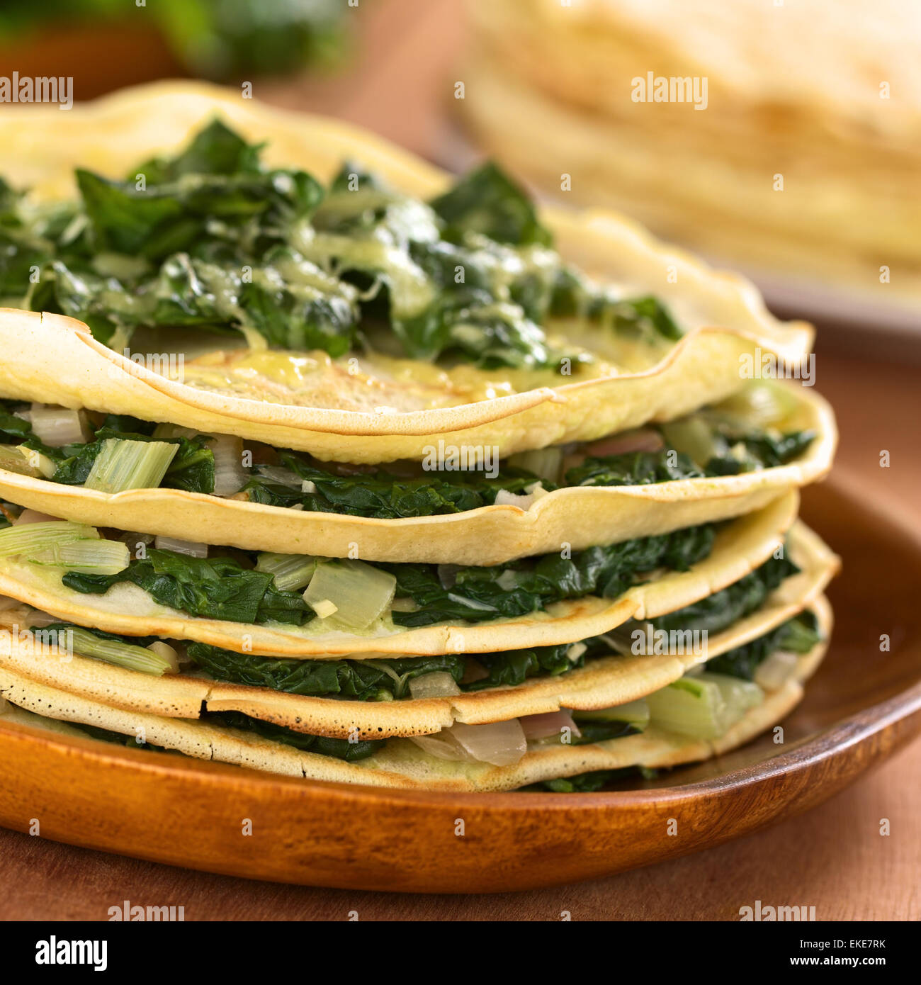 Fresh homemade savory crepes layered with chard (mangold) and onion