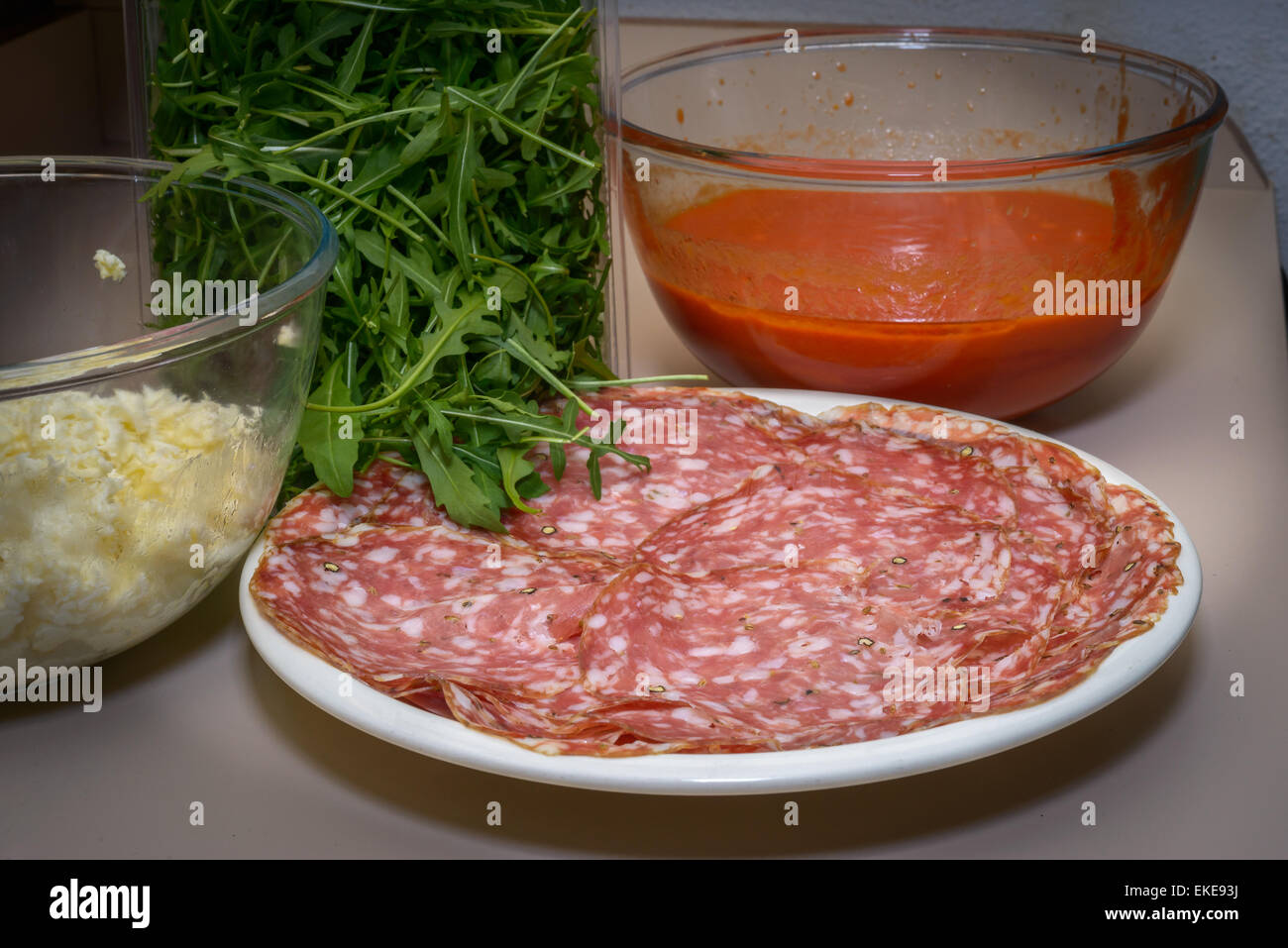 A Tipical Tuscany italian salami called finocchiona with rucola, tomato