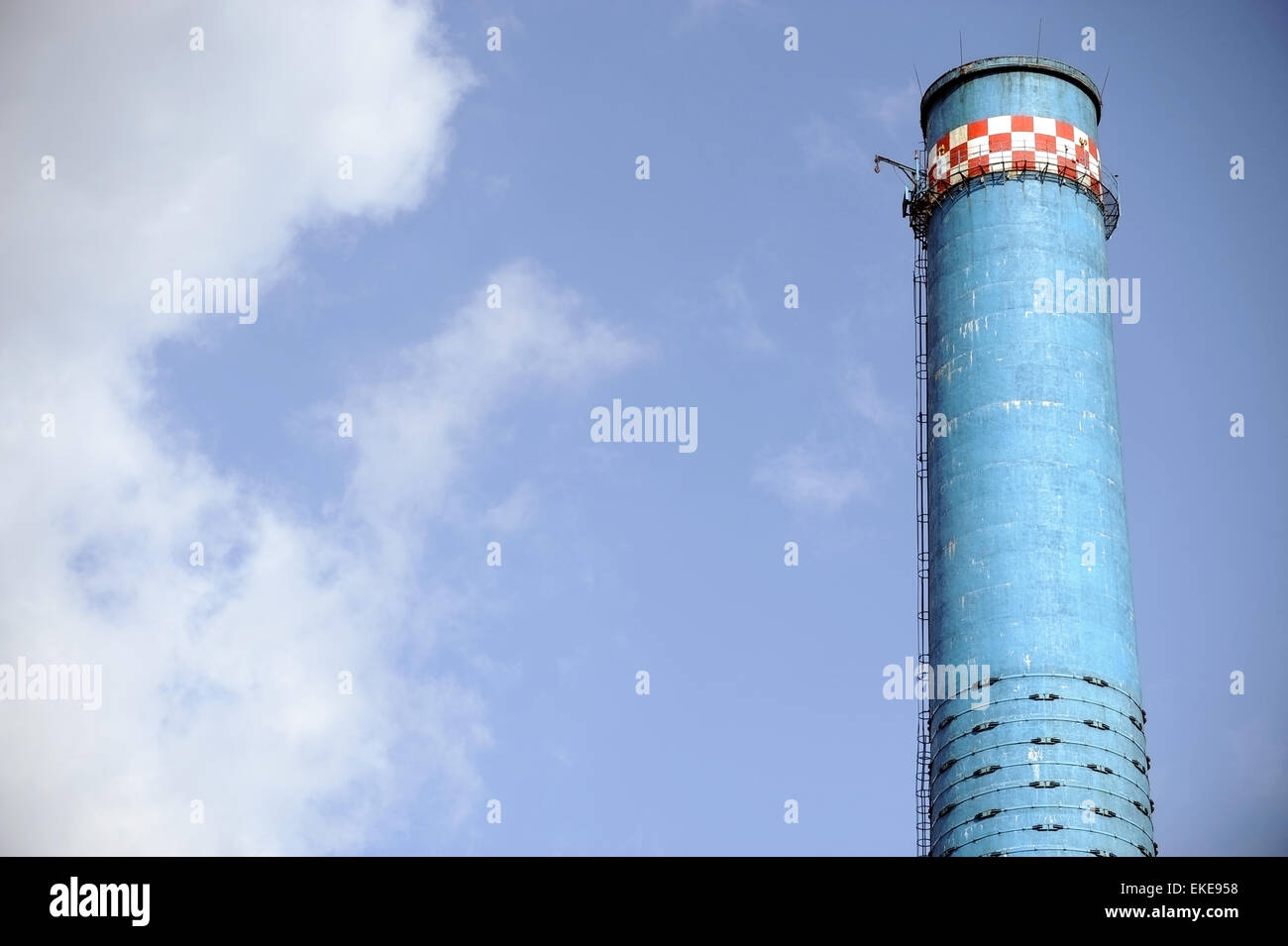 Industrial shot with one blue smoke tower of a thermal power plant Stock Photo