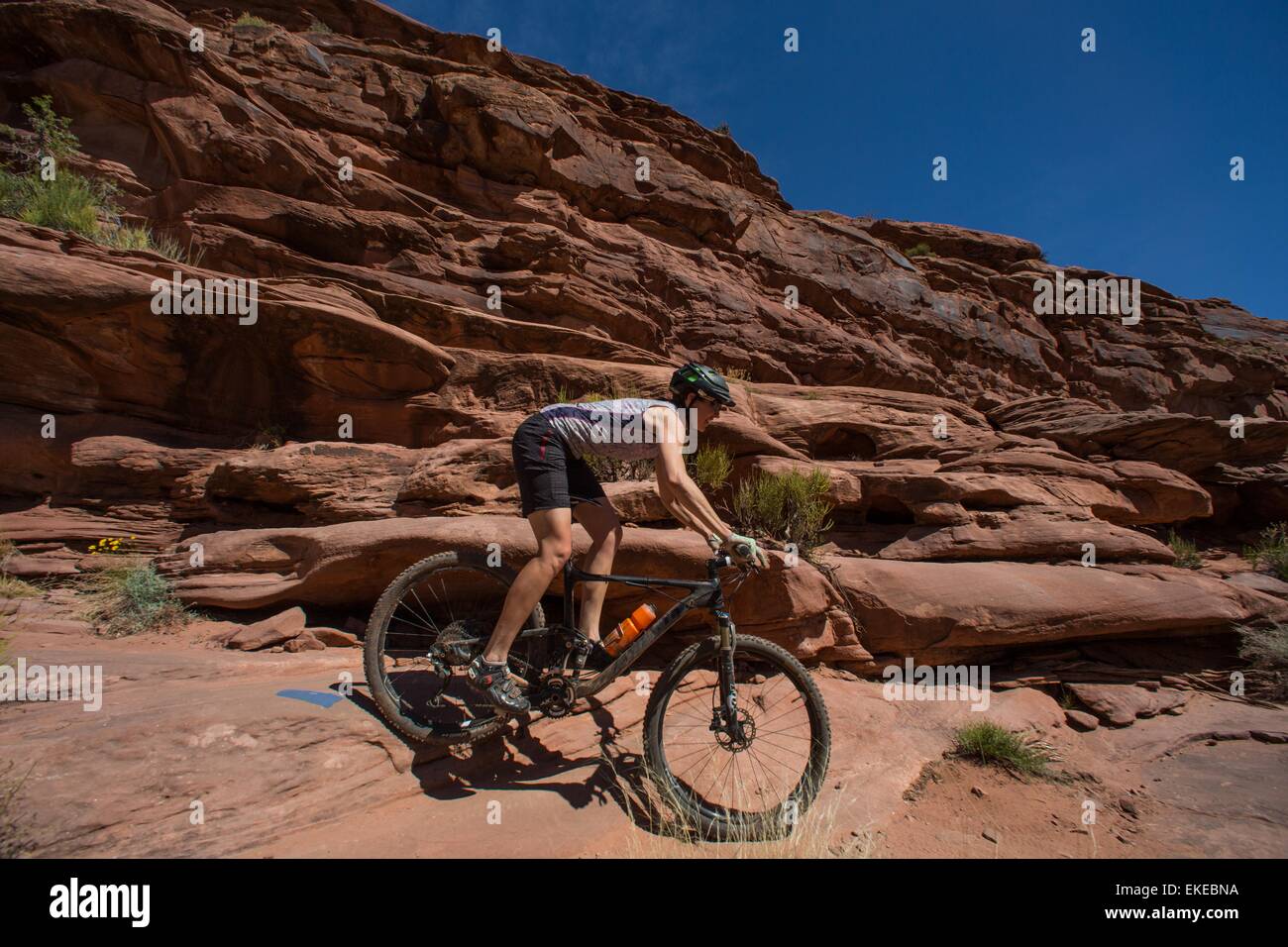 Apr 5, 2015 Moab, Utah, U.S. A woman rides her Mountain bike on the