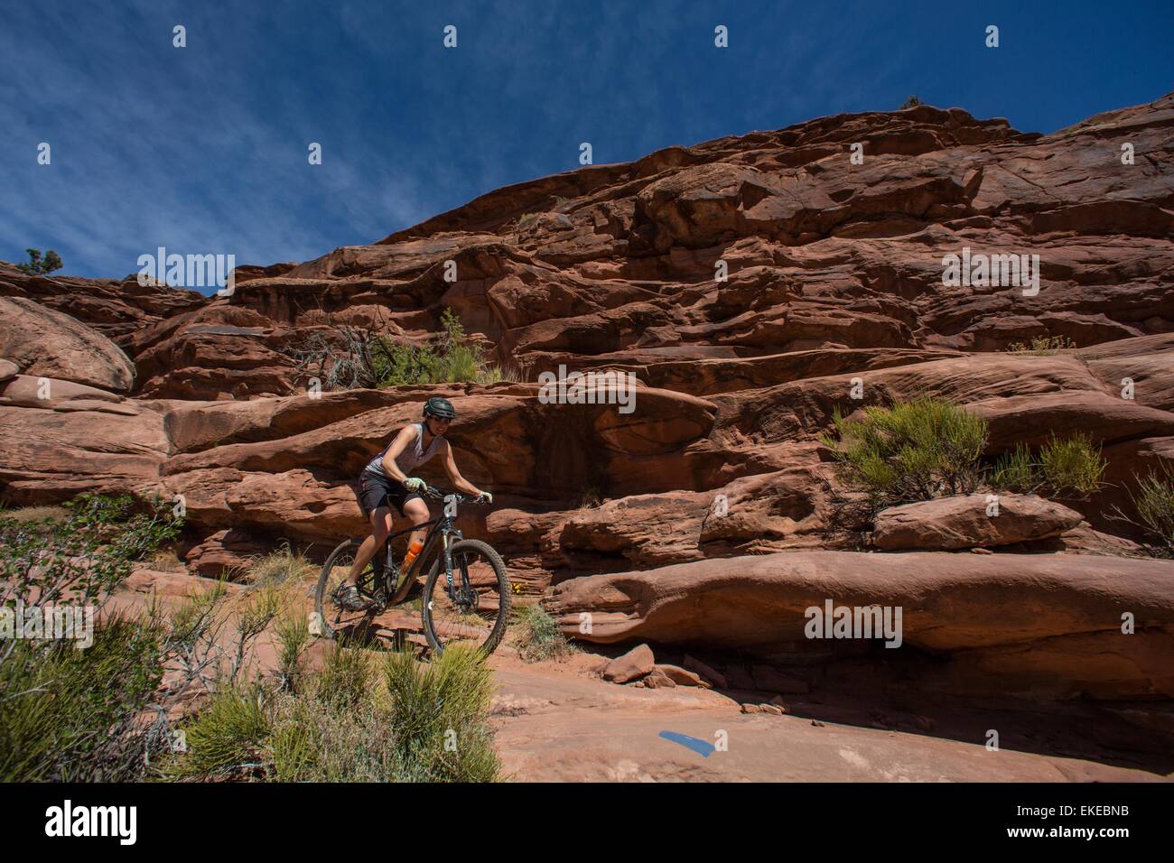 Apr 5, 2015 Moab, Utah, U.S. A woman rides her Mountain bike on the