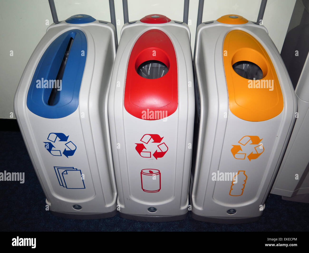 Colour coded recycling bins in office Stock Photo Alamy