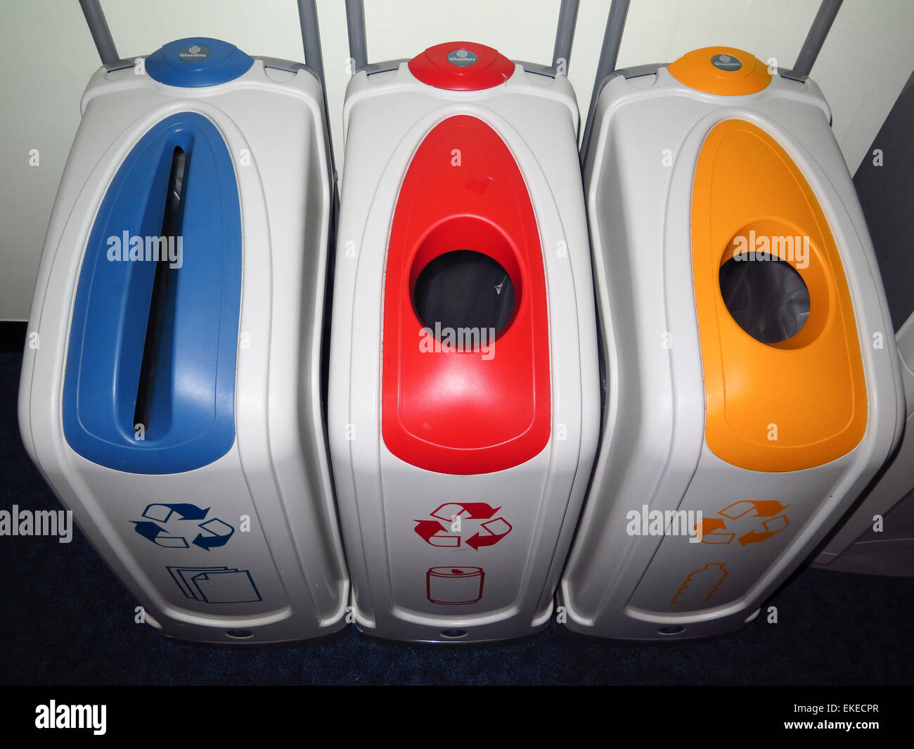 Colour coded recycling bins in office Stock Photo Alamy
