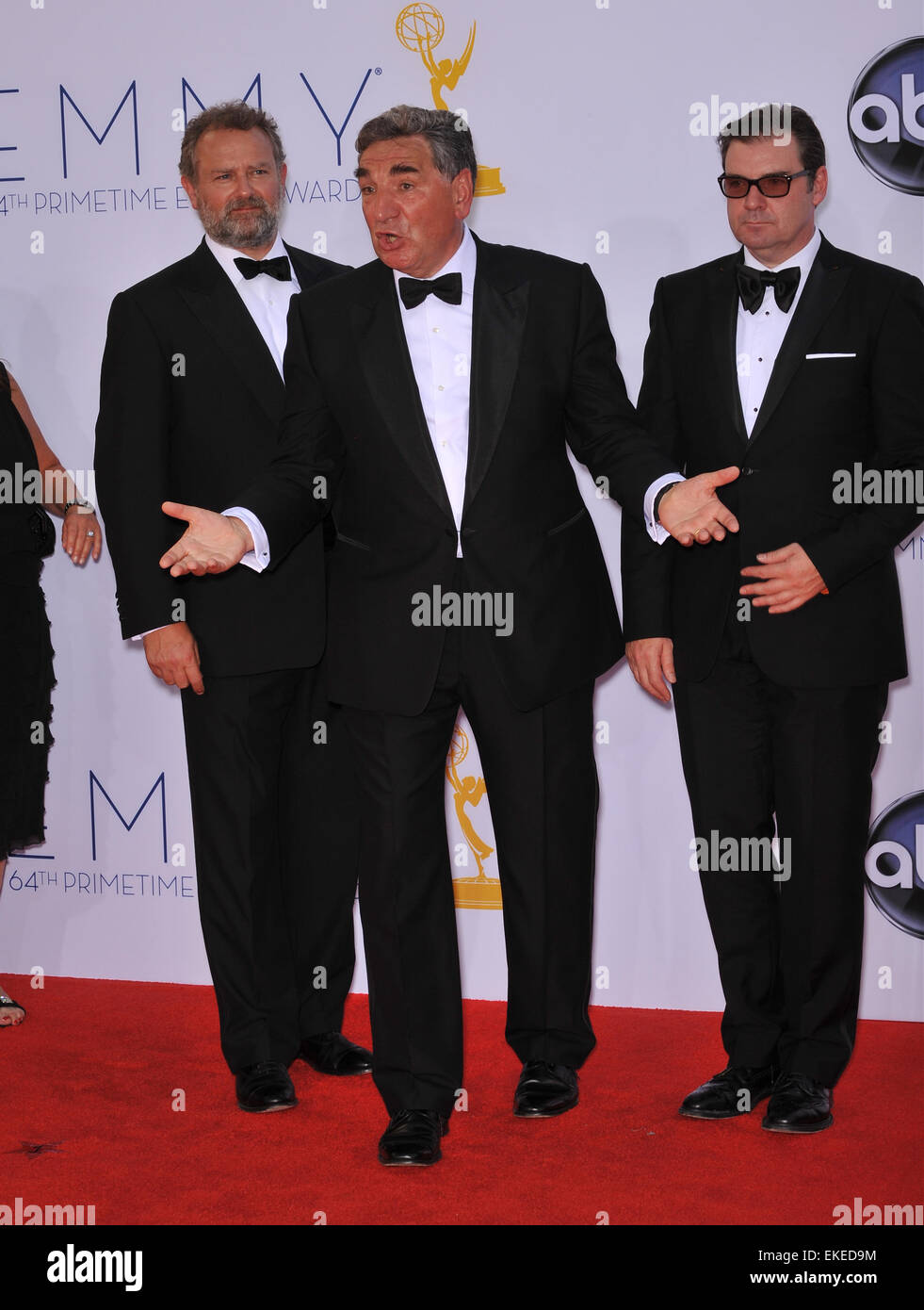 LOS ANGELES, CA - SEPTEMBER 23, 2012: Downton Abbey stars Hugh Bonneville, Brendan Coyle & Jim Carter at the 64th Primetime Emmy Awards at the Nokia Theatre LA Live. Stock Photo