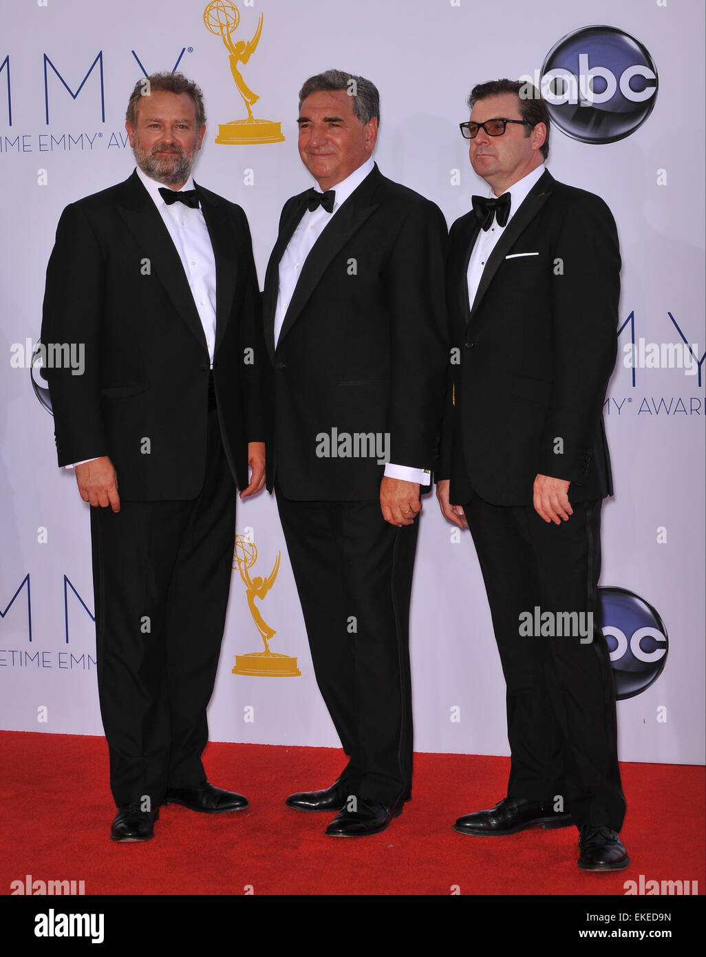 LOS ANGELES, CA - SEPTEMBER 23, 2012: Downton Abbey stars Hugh Bonneville, Brendan Coyle & Jim Carter at the 64th Primetime Emmy Awards at the Nokia Theatre LA Live. Stock Photo