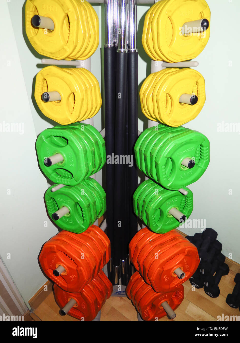 Lifting weights on rack in gym Stock Photo Alamy