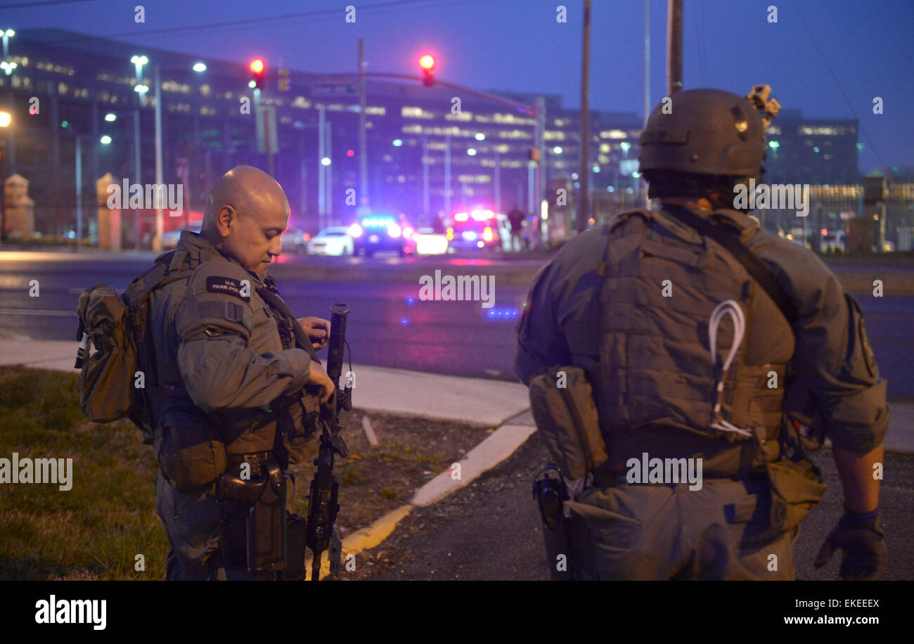 Suitland, USA. 9th Apr, 2015. A policeman walks across the street
