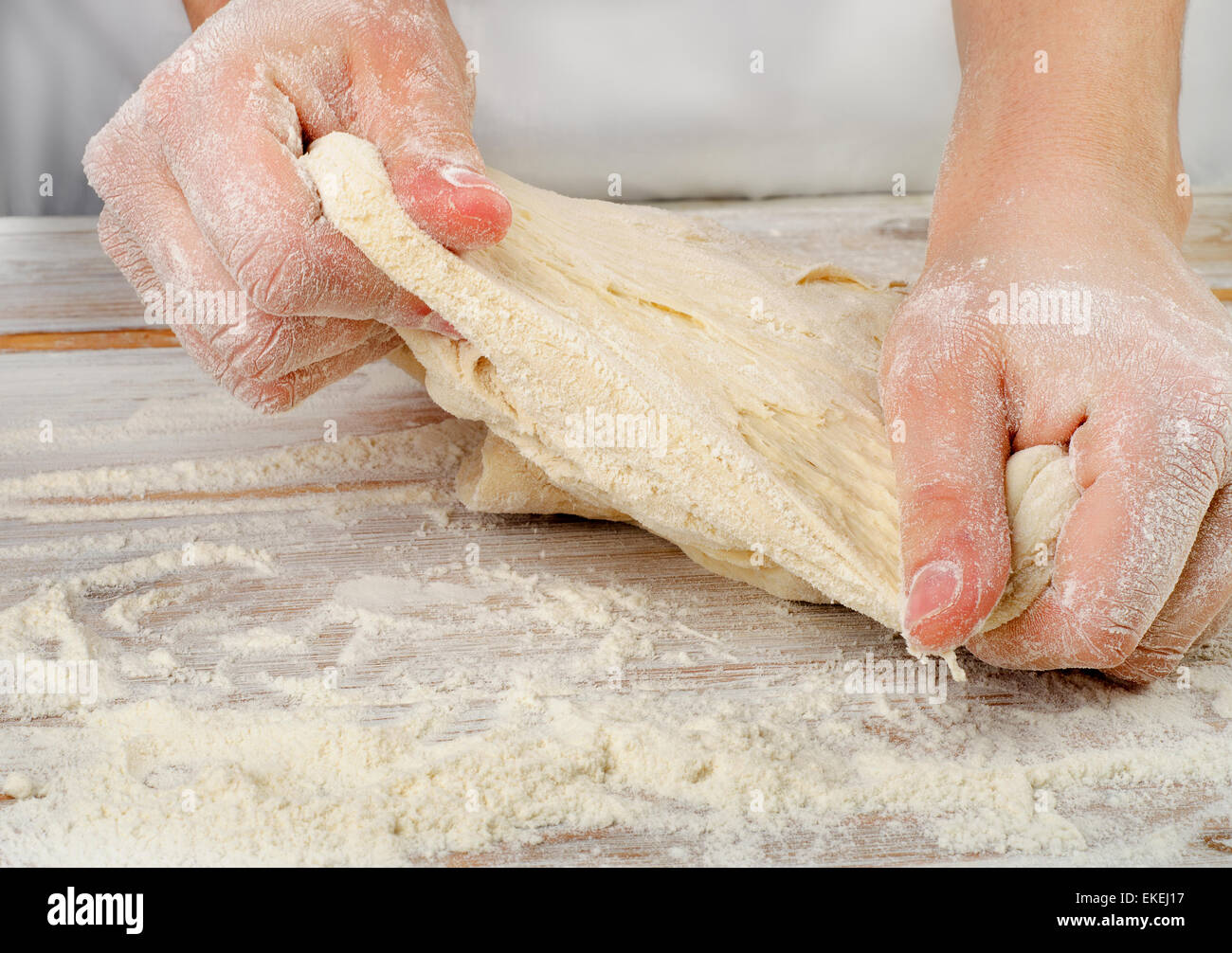 Hands kneading dough in flour hi-res stock photography and images - Alamy