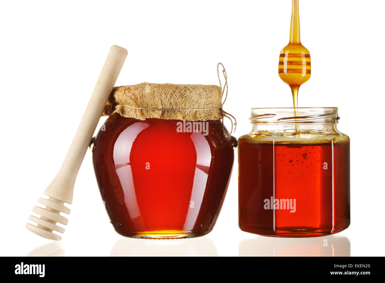Jars of honey and dipper Stock Photo Alamy