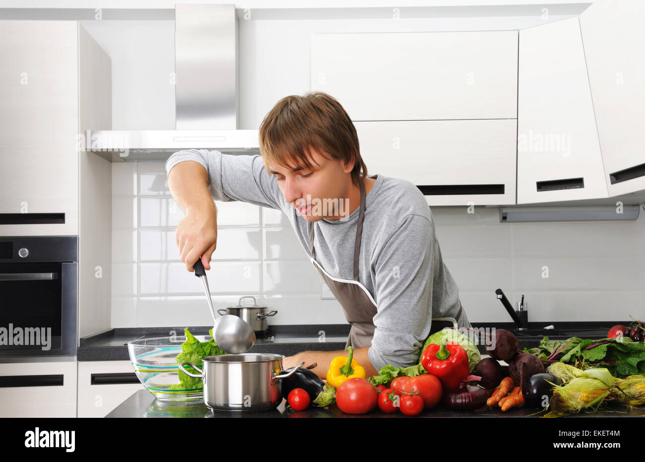 Man Using Kitchen Machine Man in kitchen Stock Photo - Alamy