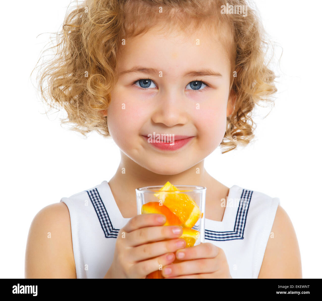 Portrait of little girl drinking orange juice Stock Photo - Alamy