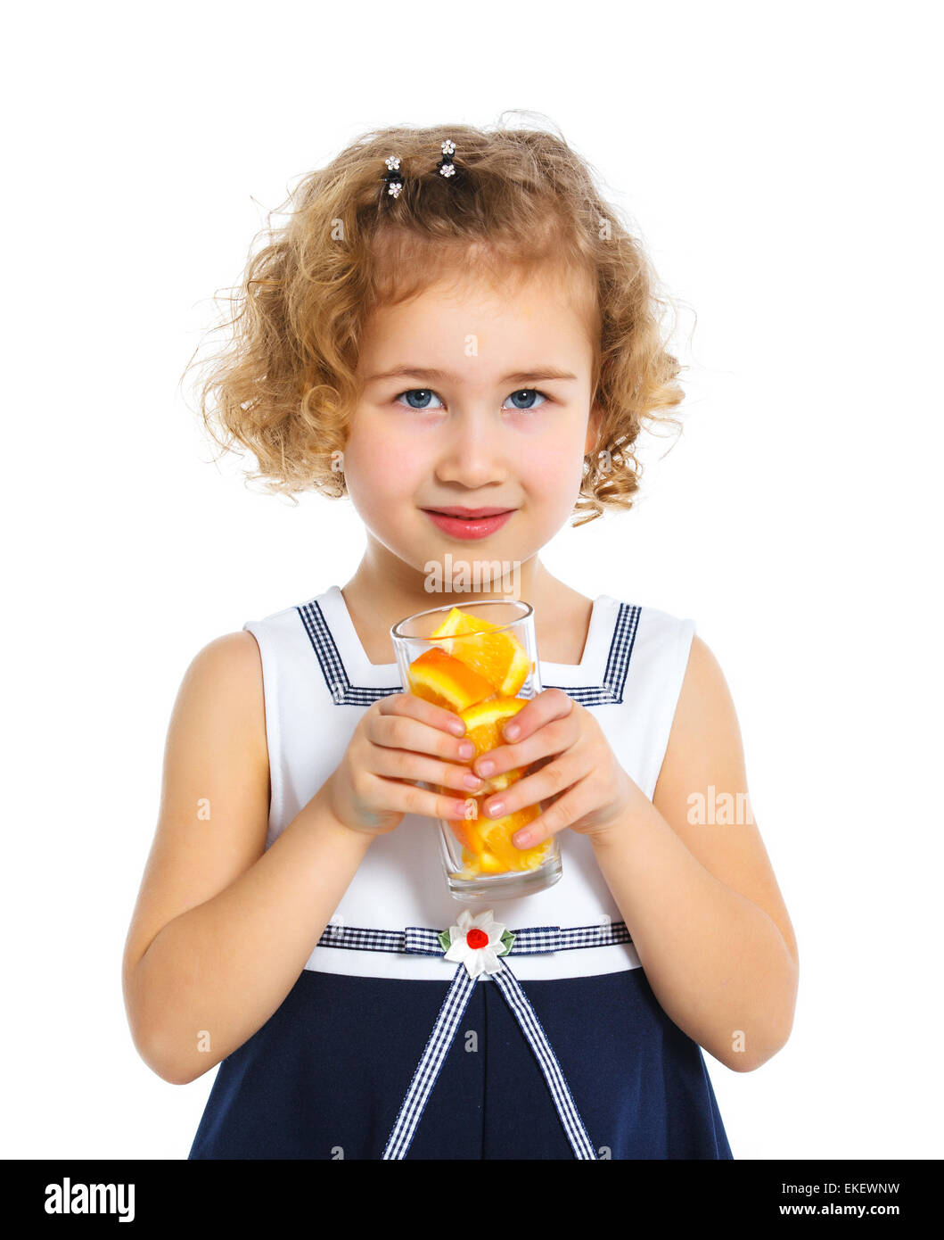 Portrait of little girl drinking orange juice Stock Photo - Alamy