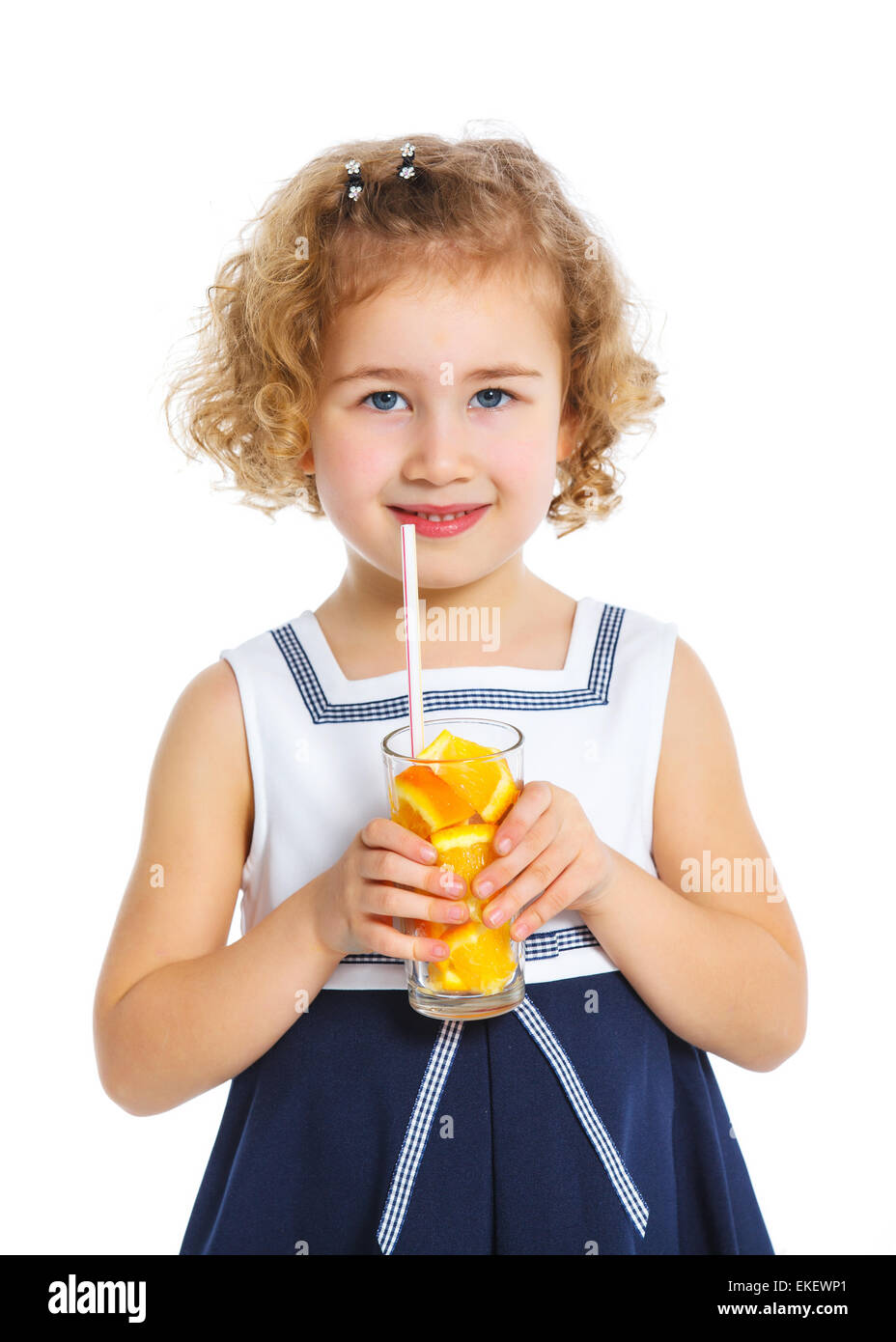 Portrait of little girl drinking orange juice Stock Photo - Alamy