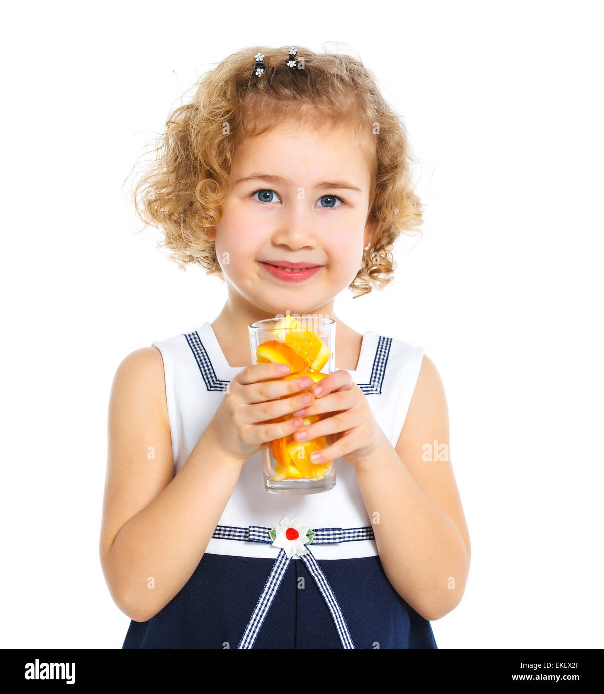 Portrait of little girl drinking orange juice Stock Photo - Alamy