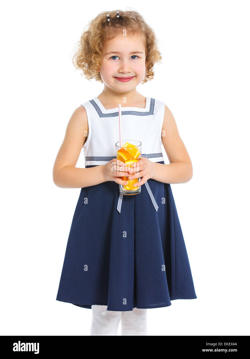 Portrait of little girl drinking orange juice Stock Photo - Alamy