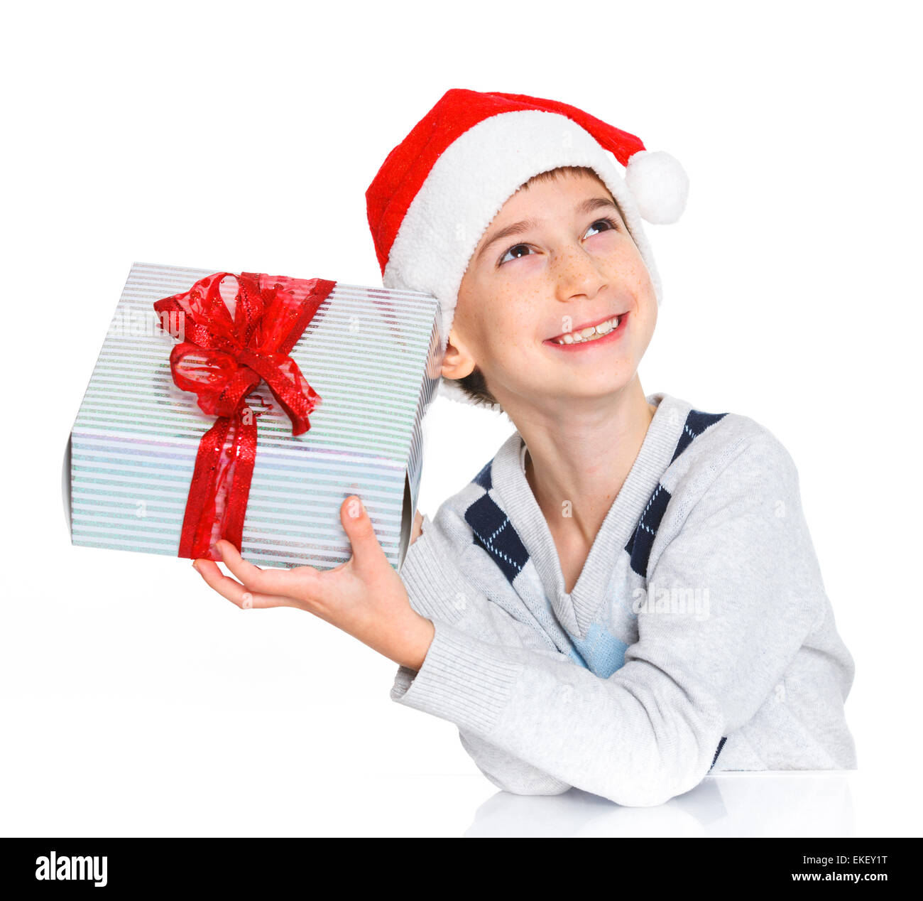 Little boy in Santa's hat with gift box Stock Photo Alamy