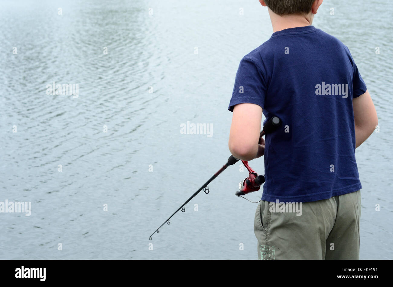 Boy fishing small dock hi-res stock photography and images - Alamy