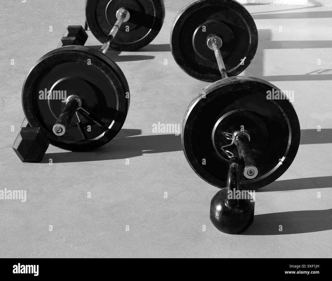 Kettlebells at crossfit gym with lifting bar weights Stock Photo Alamy