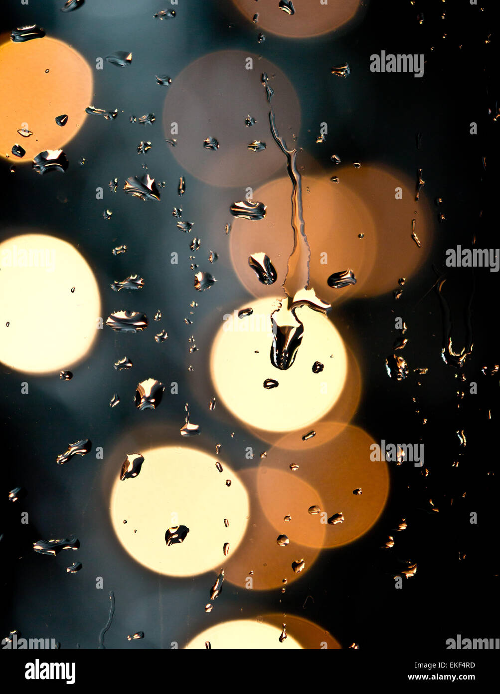 Drops of rain on window with bokeh lights abstract Stock Photo - Alamy