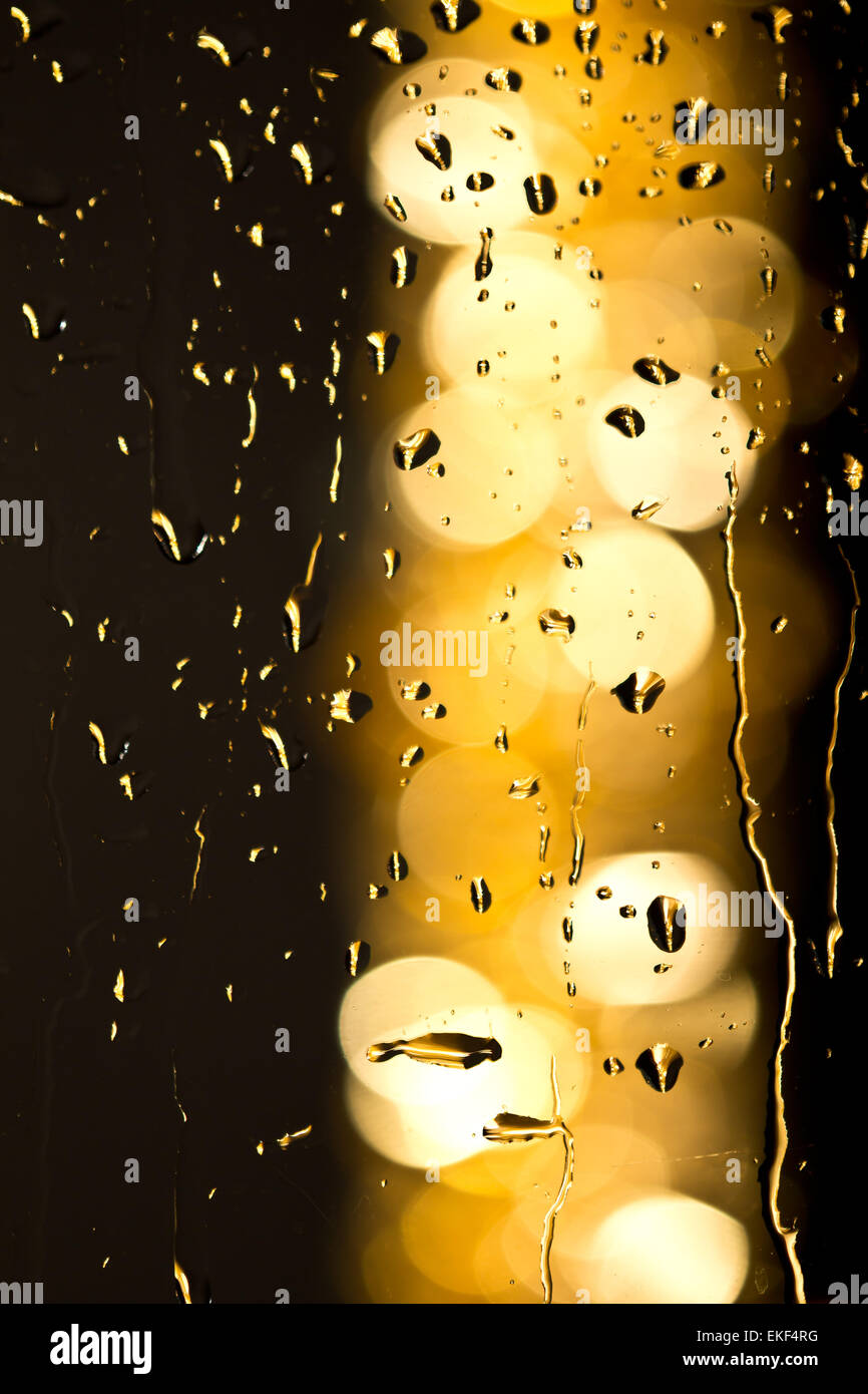 Drops of rain on window with bokeh lights abstract Stock Photo - Alamy