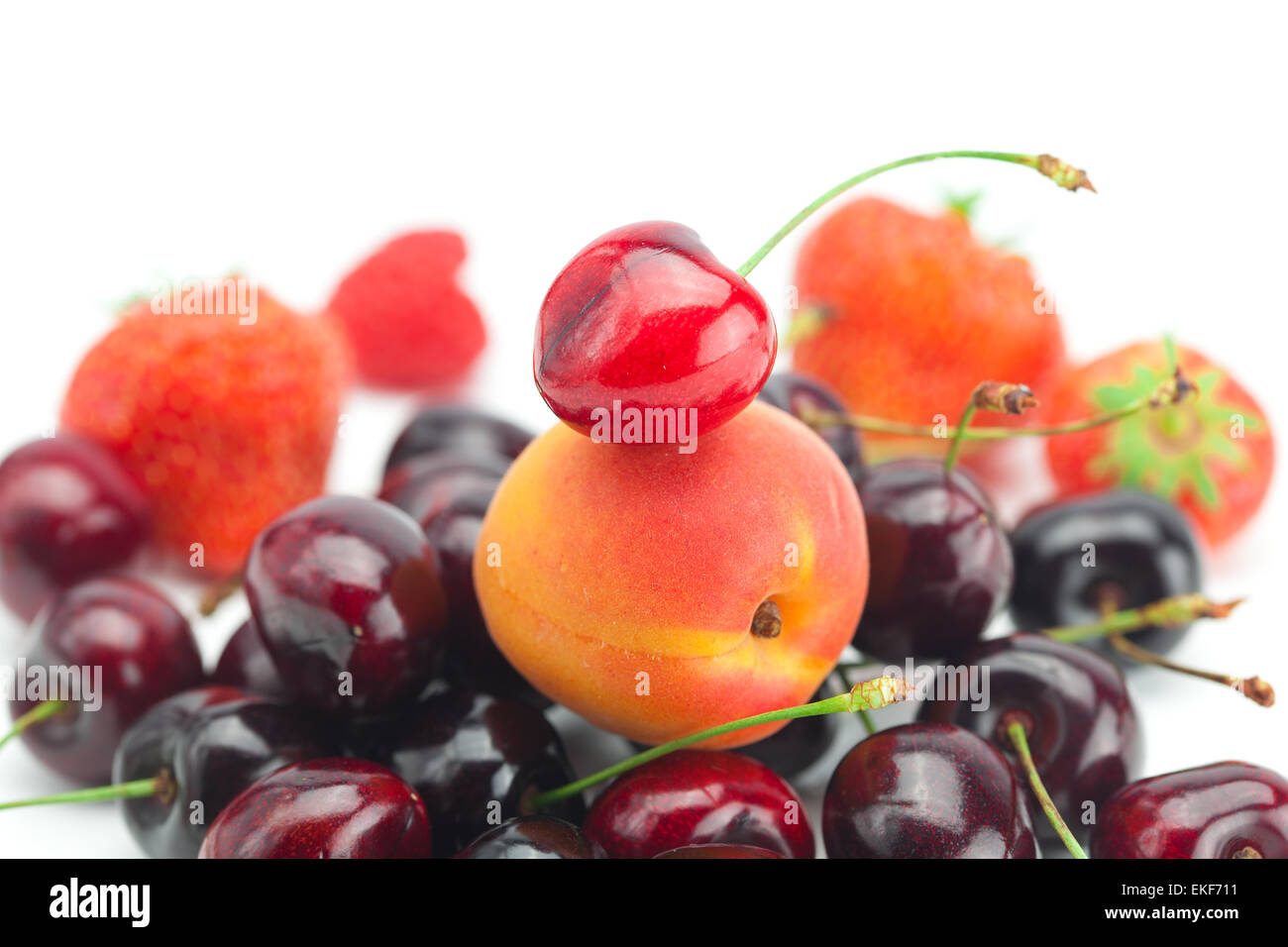 strawberry, apricot, cherry and raspberry isolated on white Stock Photo ...
