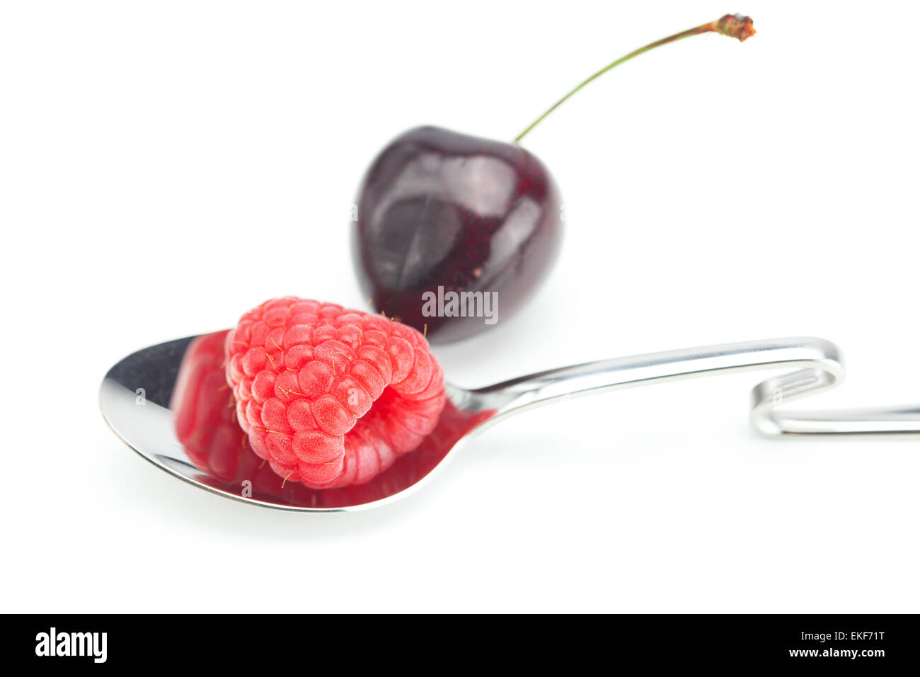 raspberry,spoon and cherry isolated on white Stock Photo - Alamy