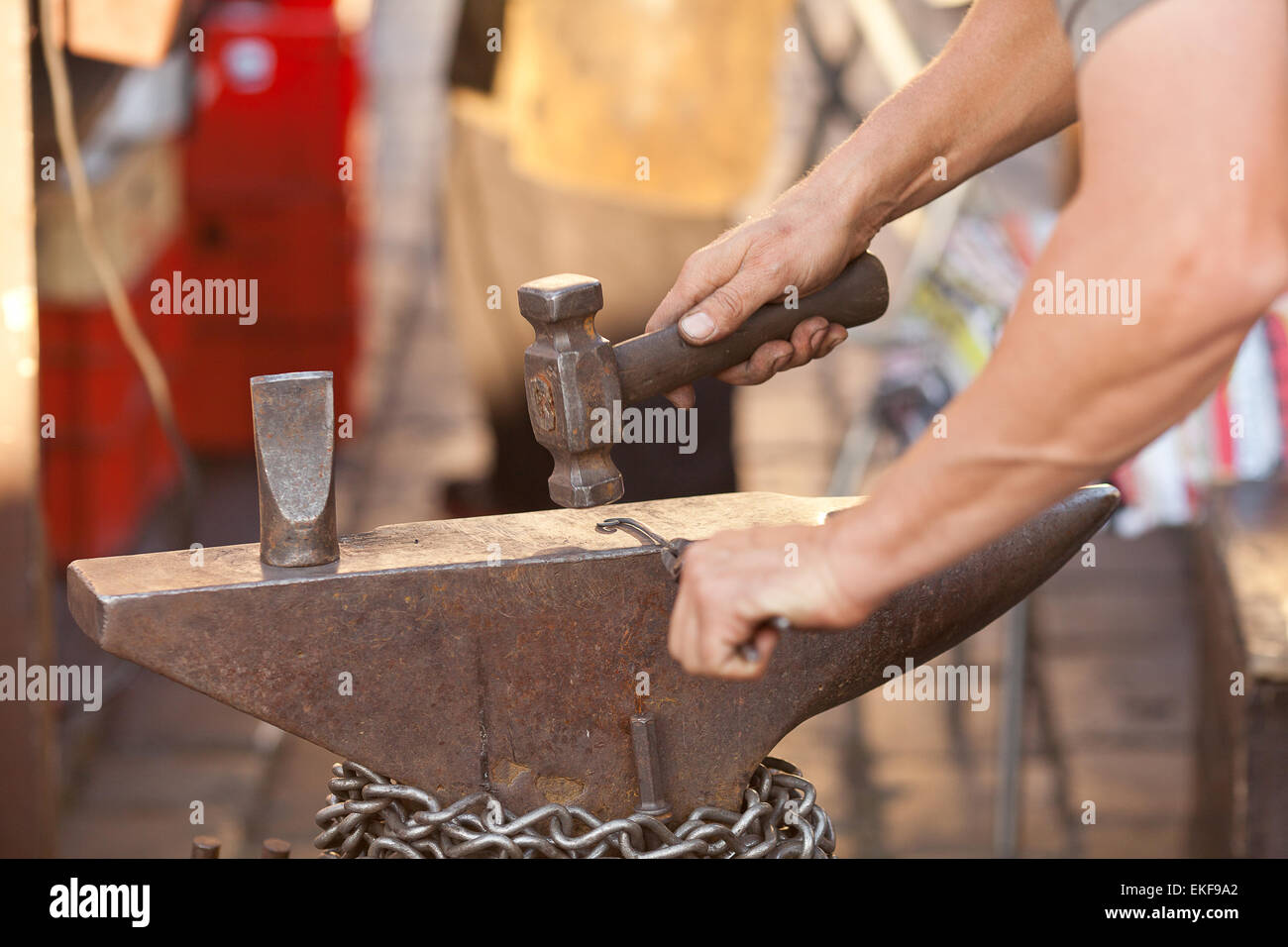 hammer, anvil and the hands of a blacksmith Stock Photo - Alamy