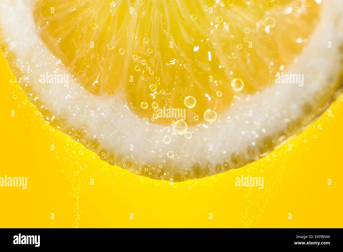 slice of lemon close up, dipped in sparkling water Stock Photo