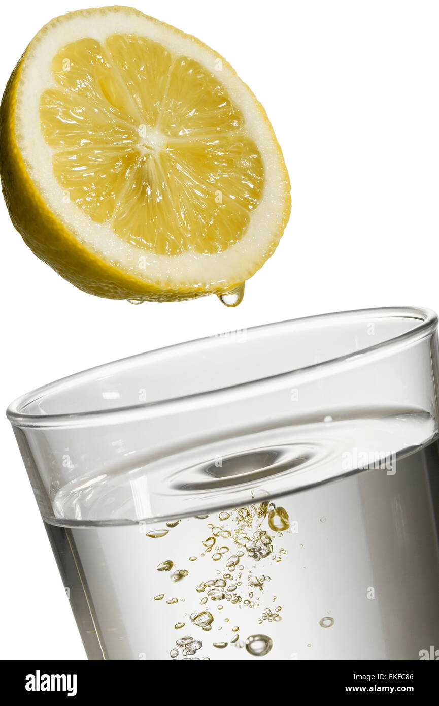 lemon drop on natural water glass, on white background Stock Photo