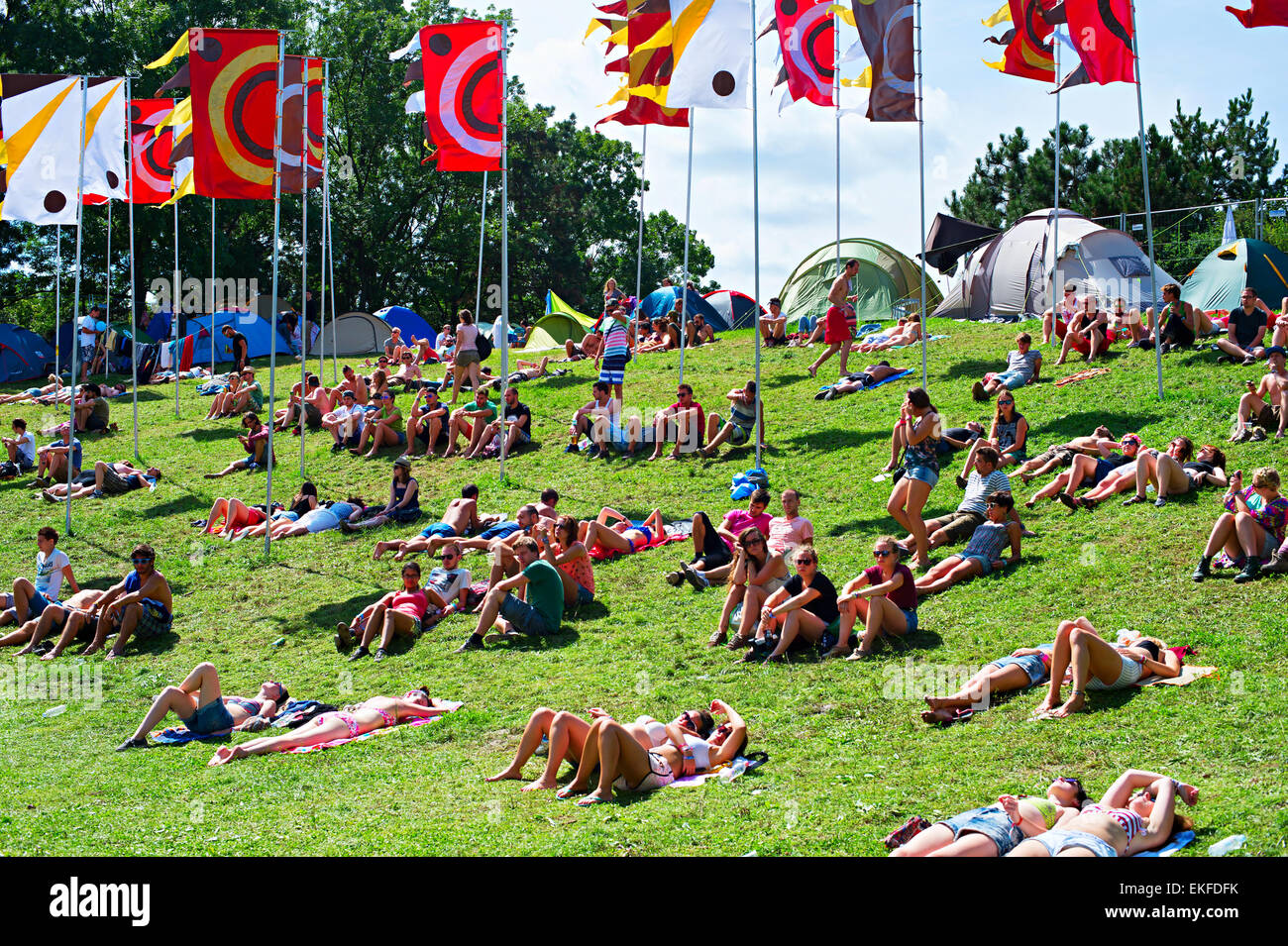Visitors of Sziget music festival relaxing in the day. Stock Photo