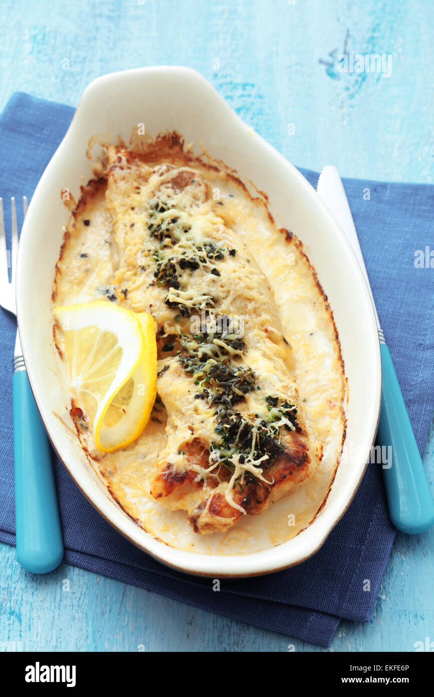 Cooked fish with spinach Stock Photo Alamy
