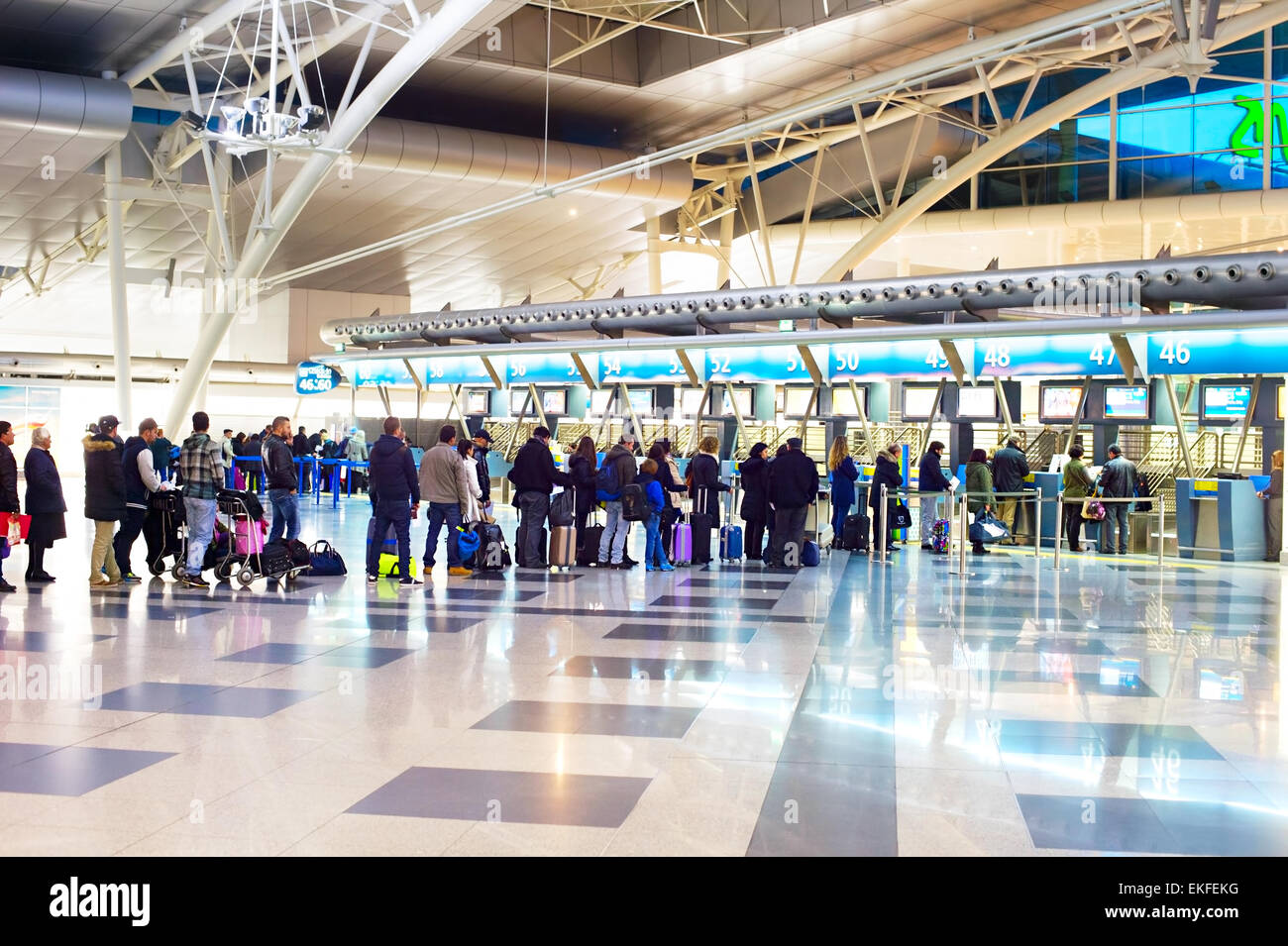 People waiting in queue at a check-in counter in Francisco Sa Carneiro Airport. The airport was Stock Photo