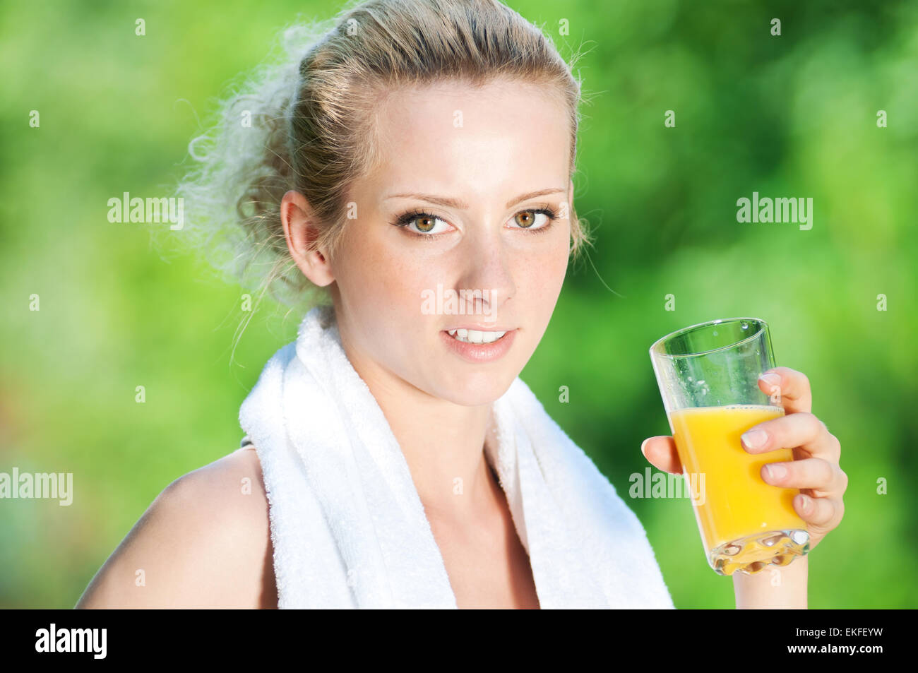 Woman drinking juice after exercise Stock Photo Alamy