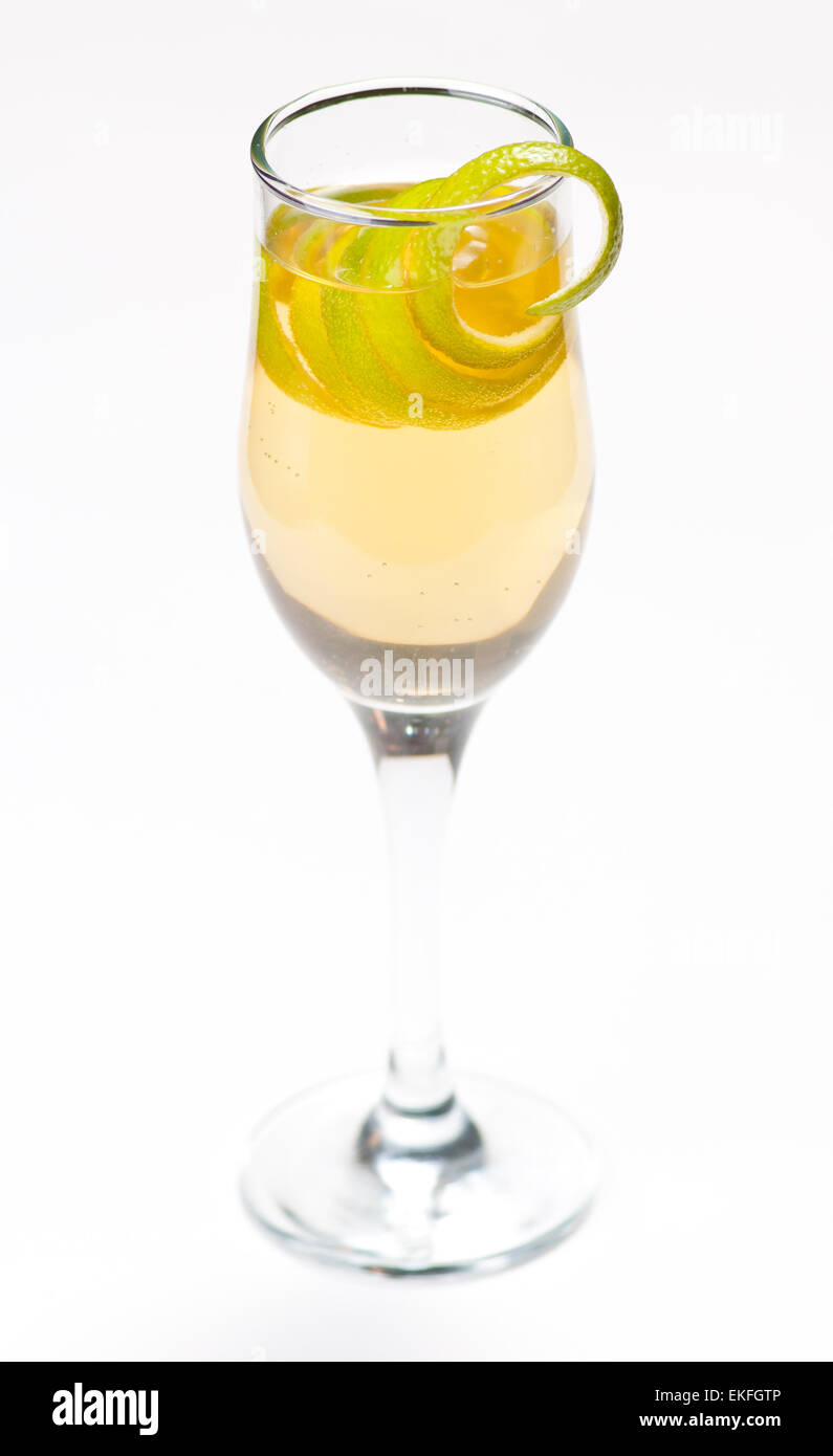 Yellow cocktail in glass with lemon twist Stock Photo